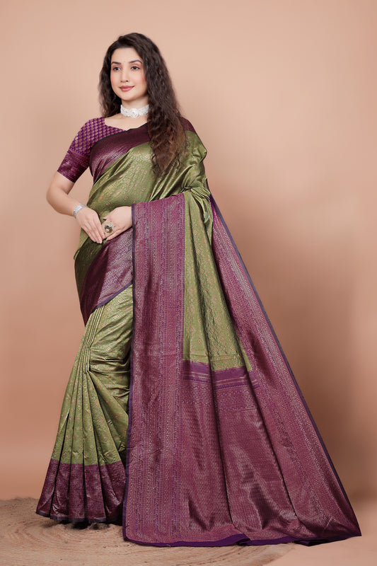 Full front view of a woman wearing a mehndi green and cherry red woven silk saree