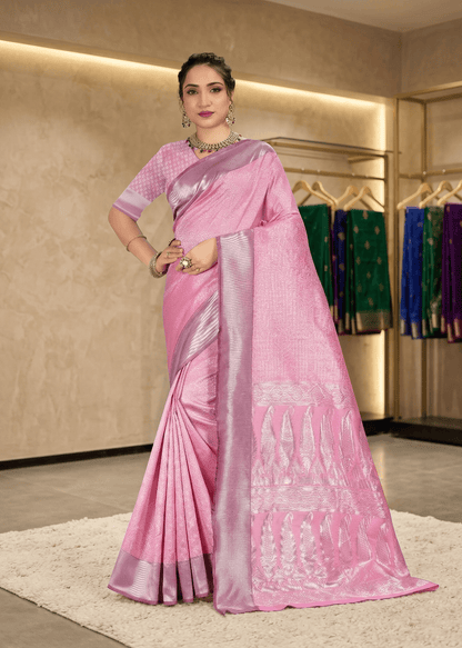 Full front pose showing the rich texture and elegant fall of the pink traditional saree